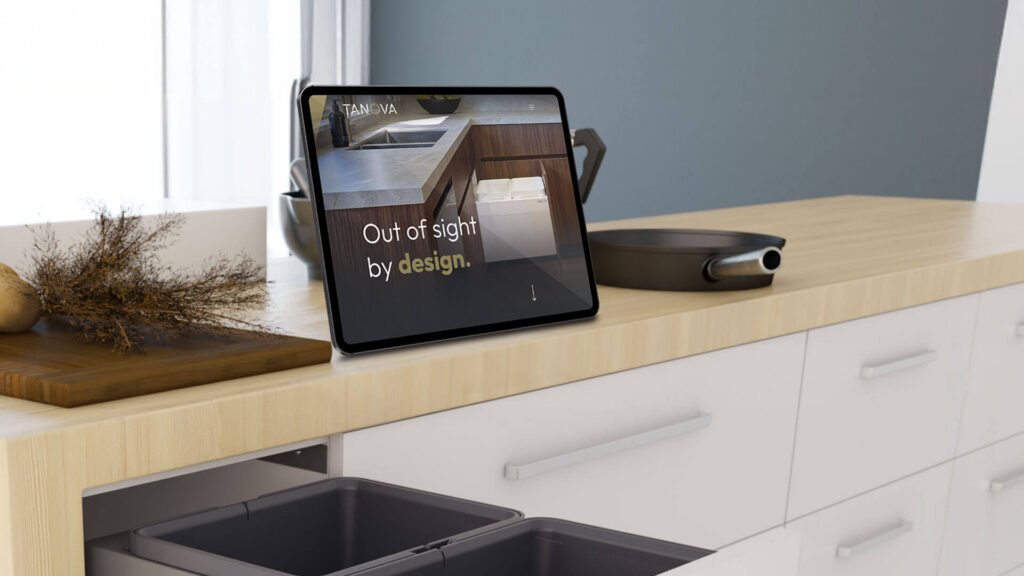 ipad on a stand in a kitchen showing Tanovas website